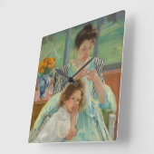 Jonge moeder naaien vierkante klok (Hoek)