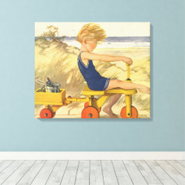 jongen die aan de strand met zandspeelgoed speelt canvas afdruk