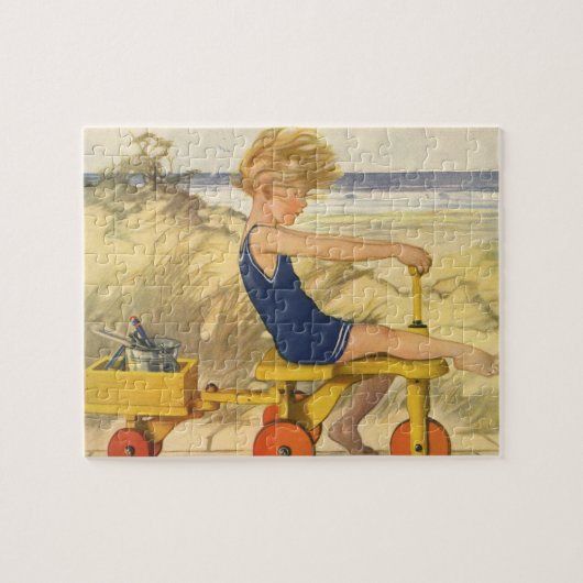 jongen die aan de strand met zandspeelgoed speelt legpuzzel (Horizontaal)