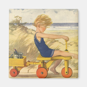  jongen die aan de strand met zandspeelgoed speelt magneet