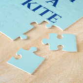 Jongen die vliegende vliegende kietenpuzzel. legpuzzel (Zijkant)