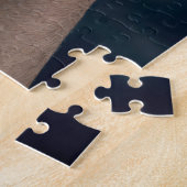 Jongen in roeiboot geleid door een kompas legpuzzel (Zijkant)