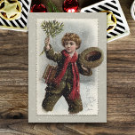 jongen in sneeuw met prettige kerstcadeautjes feestdagenkaart<br><div class="desc">Een  scholier met een krullende krullende scholier die door de sneeuw loopt om zijn pet te kantelen en een hoed van maîtletoe te zwaaien met een prettige kerstgroet.</div>