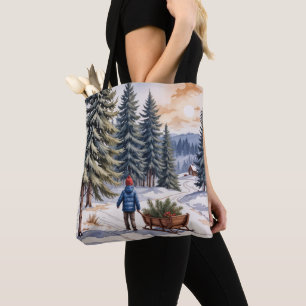 Jongen trekt slee met kerstgroen takken tote bag
