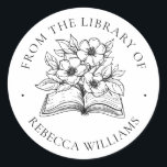 Jouw naam Boek & Bloemen Ex Libris Boekplaat Ronde Sticker<br><div class="desc">Modern, bloemetjesontwerp. Perfect voor het toevoegen van een persoonlijke touch aan uw gekoesterde boek collectie. Het ontwerp toont een open boek dat explodeert met bloemen en bladeren. De woorden 'Uit de Bibliotheek van' vormen een boogvormige rand en onder het boek jouw naam komt in klassieke seriële letters voor. Een prachtig...</div>