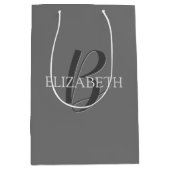 Jouw naam en monogram, grijze tekst op grijs medium cadeauzakje (Voorkant)