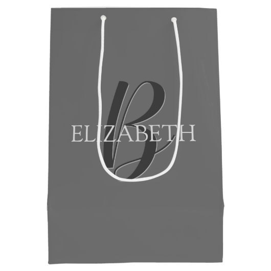Jouw naam en monogram, grijze tekst op grijs medium cadeauzakje (Achterkant)