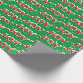 JOY-tekst met sneeuwvlokken op groene achtergrond Cadeaupapier (Hoek)