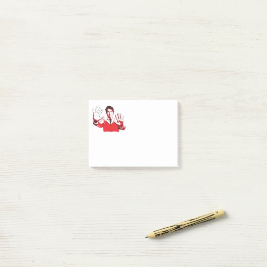 Justins handen. post-it® notes (Op bureau)