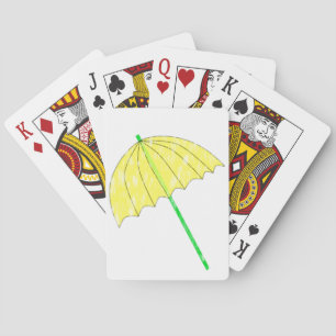 Kaartspelend onder een gele paraplu en regen pokerkaarten