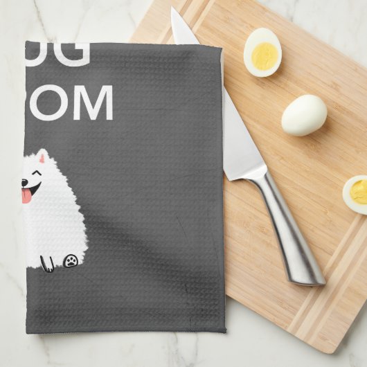 Kalm houden en een pom-pommern vasthouden theedoek (Quarter Fold)