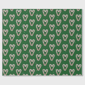 Kandijrietharten en sneeuwvlokken op groen cadeaupapier (Vlak)