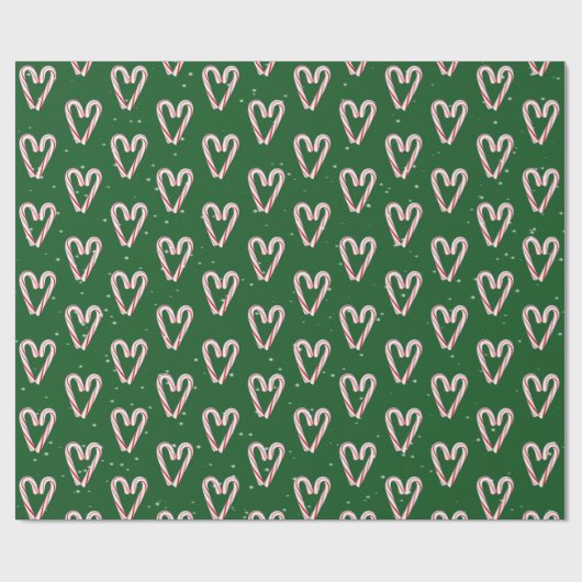 Kandijrietharten en sneeuwvlokken op groen cadeaupapier (Vlak)