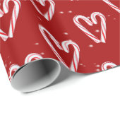 Kandijrietharten en sneeuwvlokken op rood cadeaupapier (Rol Hoek)