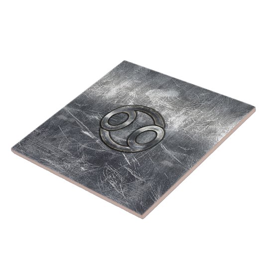 Kankerdiersymbool in gedempt decor tegeltje (Zijkant)