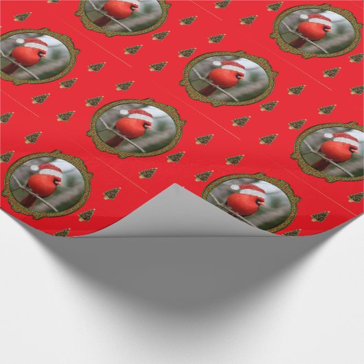 Kardinaal- en kerstbomen op rode achtergrond cadeaupapier (Hoek)