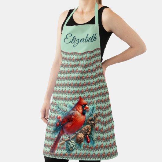 Kardinaal op dennentak met winterbessen schort (Insitu)