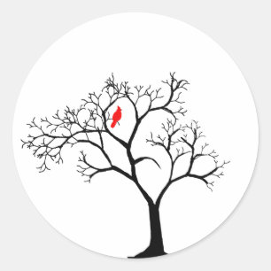 Kardinaal-rode vogel in de sneeuwwinterboom ronde sticker