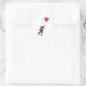 Kat dat aan een ballon drijft - kies achterkleur ronde sticker (Tas)