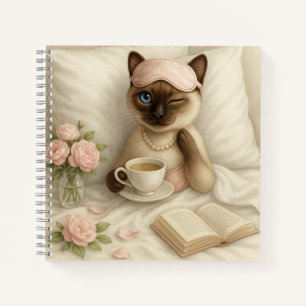 Kat drink koffie in bed notitieboek