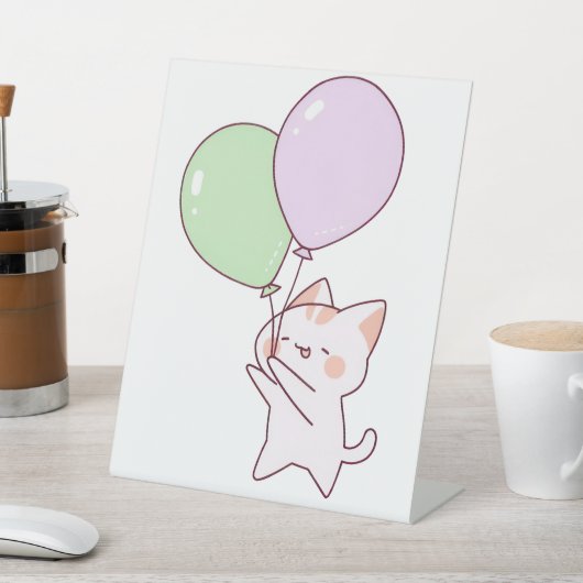 Kat houdt ballontekening vast reclamebord met voetstuk (Insitu)