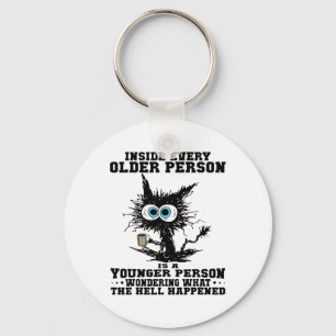 Kat In elke oudere persoon is een jongere persoon Sleutelhanger