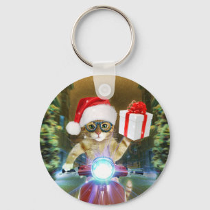 Kat in het Santa Claus-pet biedt kerstcadeau Sleutelhanger