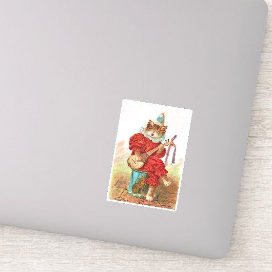 Kat in kleren aan trommelspellen sticker (Detail)