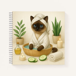 Kat is in spa met kaarslicht notitieboek