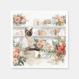 Kat is kerstbloemen aan het schikken servet
