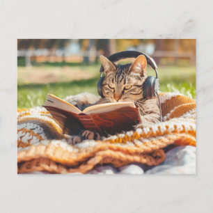 Kat leest boek op gebreide deken feestdagenkaart