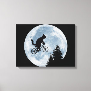 Kat rijdt fietsen op de achtergrond van de maan. canvas afdruk