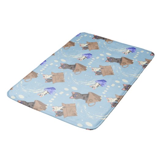 Katten in doos en melkdruppels op blauw badmat (Gekanteld)