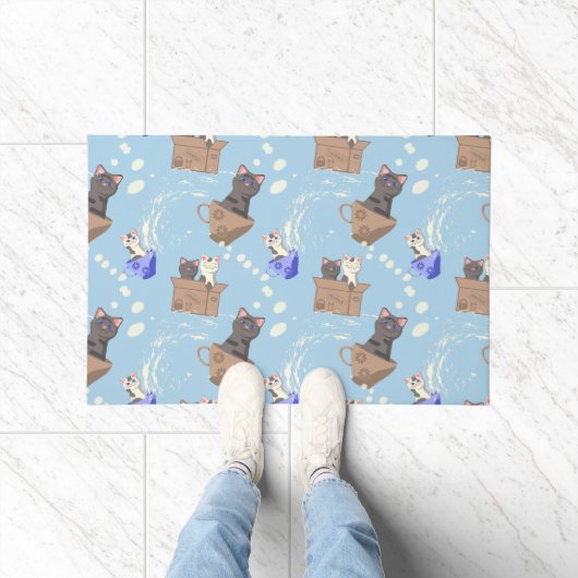 Katten in doos en melkdruppels op blauw deurmat (Binnen)