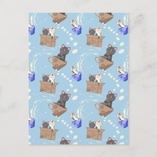 Katten in doos en melkdruppels op blauw feestdagenkaart