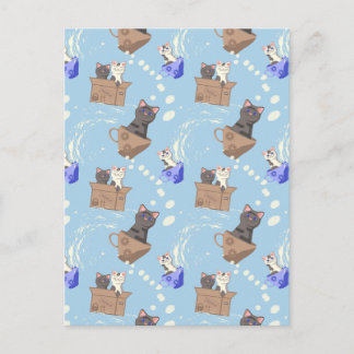 Katten in doos en melkdruppels op blauw feestdagenkaart