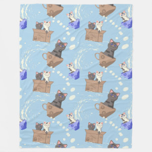 Katten in doos en melkdruppels op blauw fleece deken