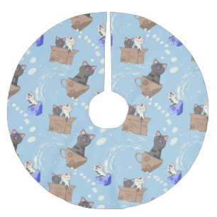 Katten in doos en melkdruppels op blauw kerstboom rok