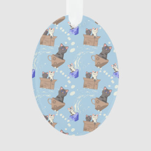 Katten in doos en melkdruppels op blauw ornament