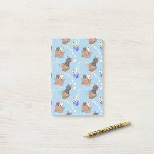 Katten in doos en melkdruppels op blauw post-it® notes