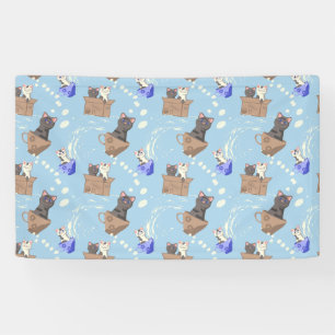 Katten in doos en melkdruppels op blauw spandoek