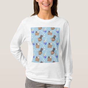 Katten in doos en melkdruppels op blauw t-shirt