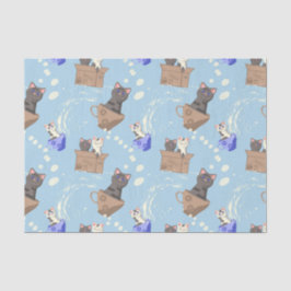 Katten in doos en melkdruppels op blauw tissuepapier