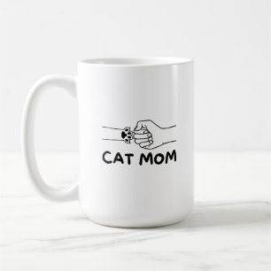 Kattenmoeder kattenpoot en vrouwen handafdruk koffiemok