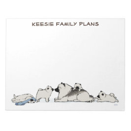 Keeshond-familie met blauwe sok notitieblok