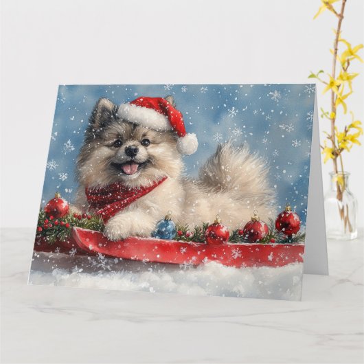 Keeshond Hond in Sledge Laat het Sneeuw Kerstmis Kaart (Gele Bloem)