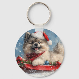 Keeshond-hond in slee Laat het sneeuwen Kerstmis Sleutelhanger