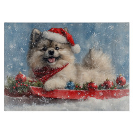 Keeshond-hond in slee Laat het sneeuwen Kerstmis Snijplank