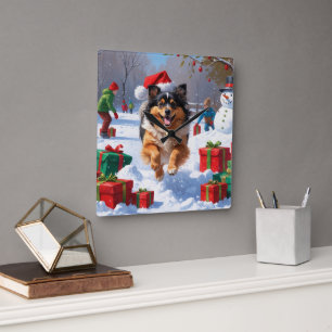 Keeshond-hond loopt in de sneeuw met kerstmuts vierkante klok