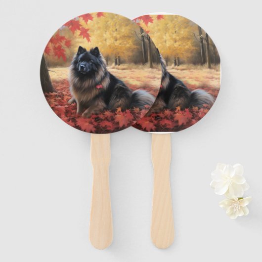 Keeshond in herfstbladeren valt inspireren  handwaaier (Voorkant en achterkant)